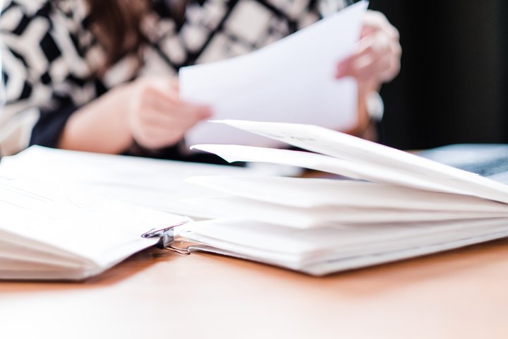 Woman sorting through mail at a table