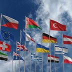 Flags with cloud in background